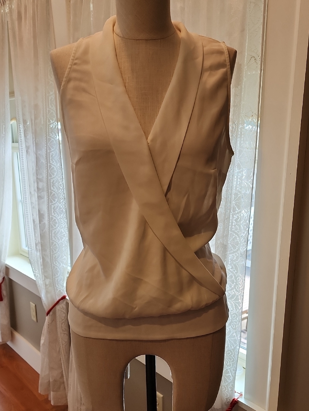 White House Black Market Sleeveless Wrap Blouse in Cream